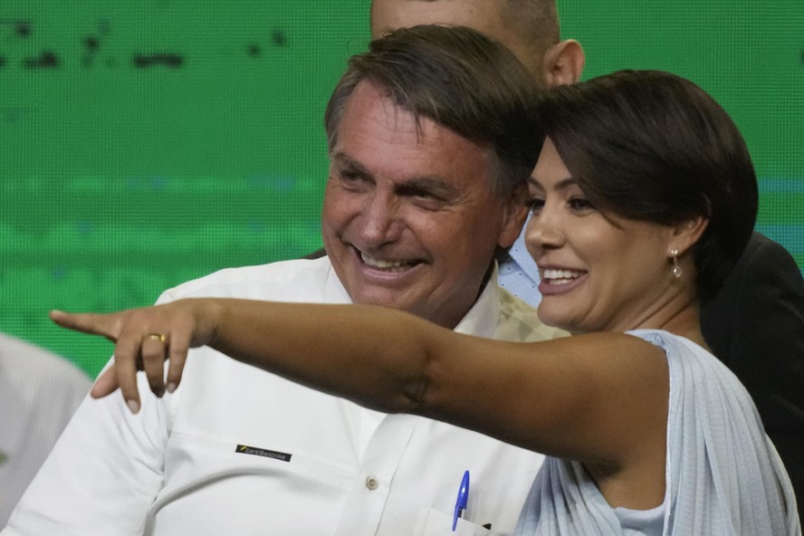 Brazil's President Jair Bolsonaro celebrates with his wife Michelle Bolsonaro, during an event with members of his Liberal Party and with supporters as he presents his candidacy for the next president