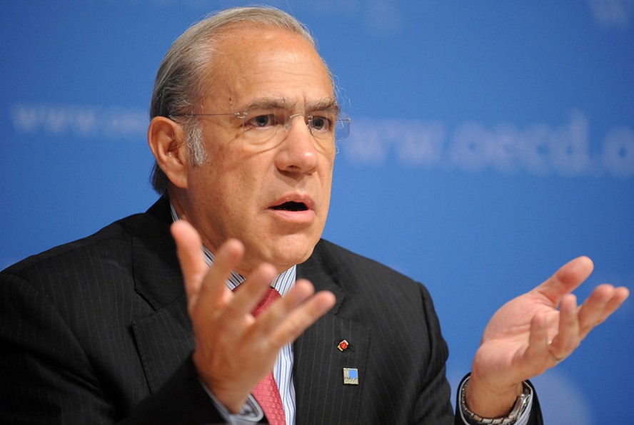 Angel Gurria, secretary-general of the Organisation of Economic Cooperation and Development (OECD), gestures while speaking at a news conference at the Organisation for Economic Cooperation and Development (OECD) headquarters in Paris, France, on Friday,