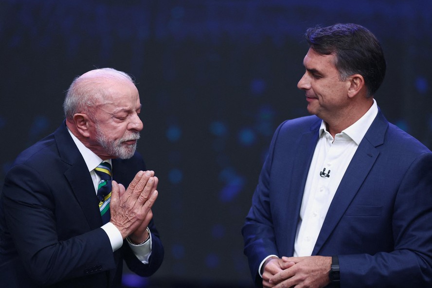 Lula e Flávio Bolsonaro no debate da TV Band