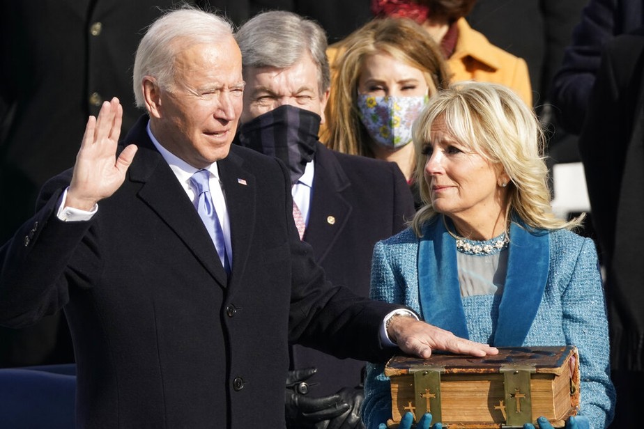 Joe Biden is sworn in as the 46th president of the United States by Chief Justice John Roberts as Jill Biden holds the Bible during the 59th Presidential Inauguration at the U.S. Capitol in Washington, Wednesday, Jan. 20, 2021. ()